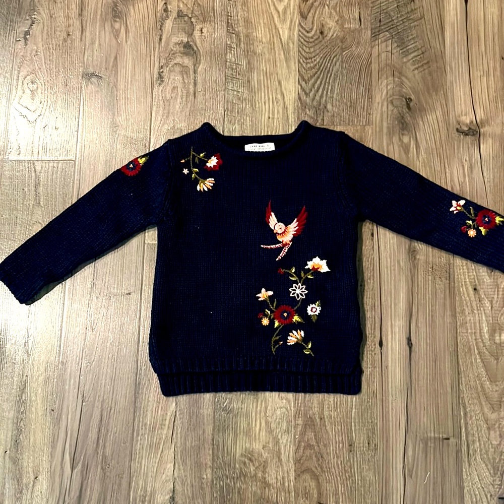 Embroidered navy blue knit sweater perfect for the winter season